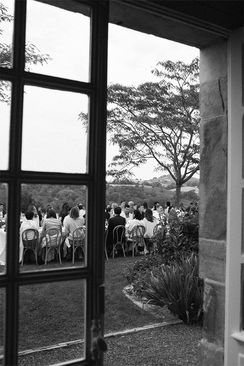 Guests enjoy an outdoor wedding reception